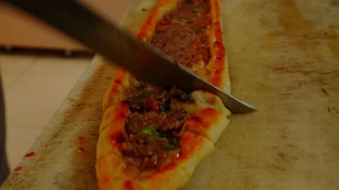 Close-up view of a chef slicing Turkish Pita. Stock Footage 209660362