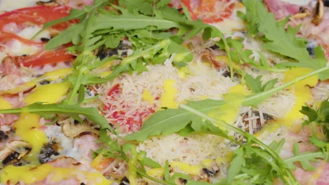 Close up view of a chef sprinkling fresh cilantro on a cooked pizza. sprinkling Stock Footage 158120691