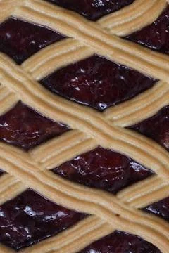 Close-up view of cherry pie crust and filling with detailed lattice design Stock Photos