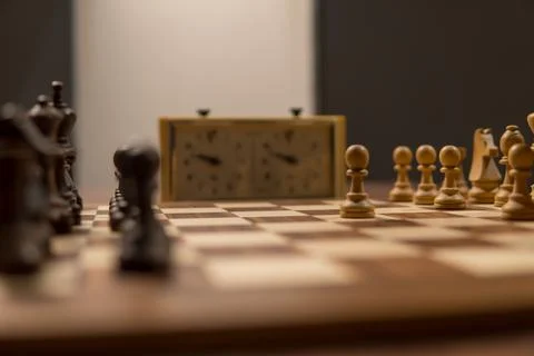A Close-Up View of a Chess Match with Timers, Highlighting the Intensity of.. Stock Photos