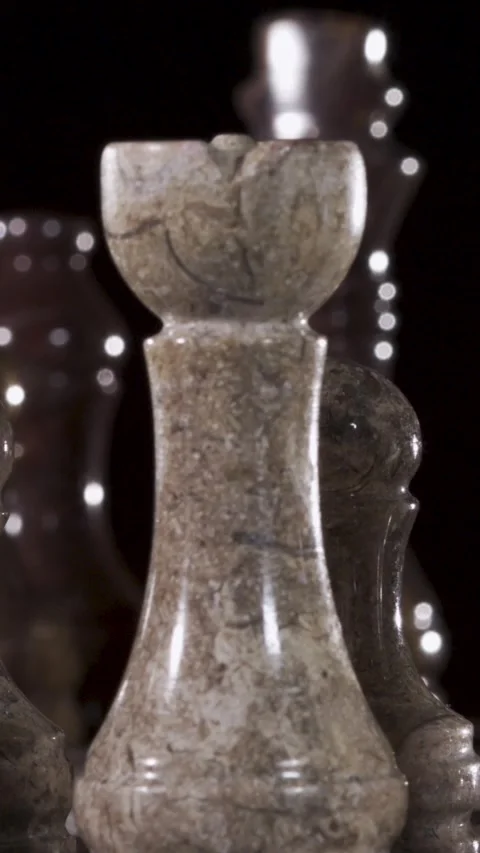 Close-up view of chess pieces made from marble or stone materials Stock Footage 340482580