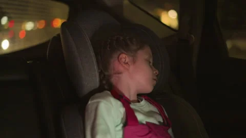 Close View of a Child Sleeping Peacefully in a Car with Passing Cars Stock-Footage 281067482