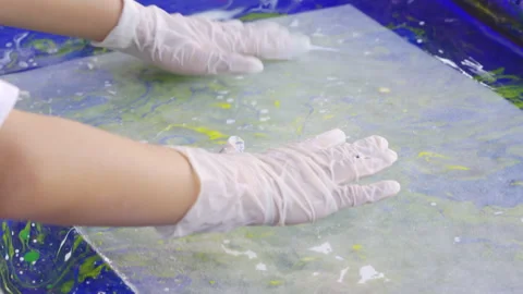 Close-up view of a child's gloved hands traditionally making mulberry paper 库存影片 329925377