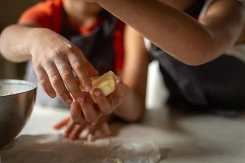 Close view of child's hands taking butter Stock Photos