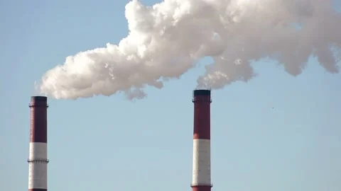 Close-up view of Chimneys Power Plant at Daylight. Air Pollution Concept. Stock Footage 99744536