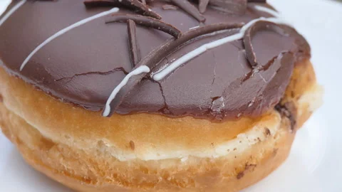 A close up view of a chocolate donut. Stock Footage 109182690