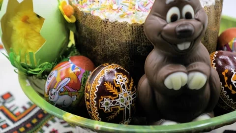 Close up view of Chocolate Easter rabbit with decorated eggs and cake Stock Footage 276312944