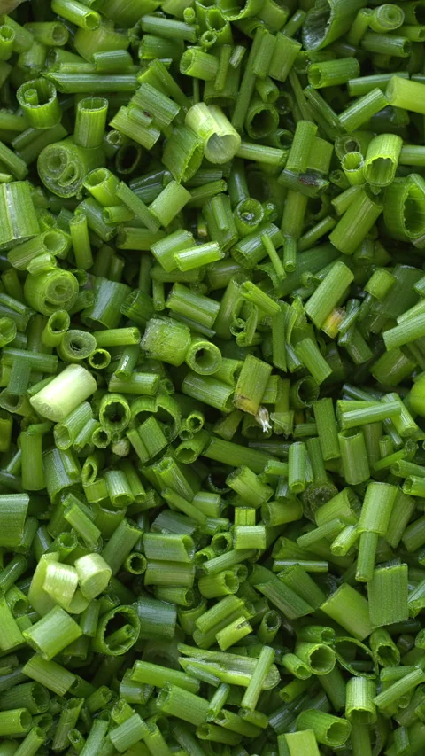 Close-up view of chopped chives background texture. Vertical video. Stock Footage 308784270