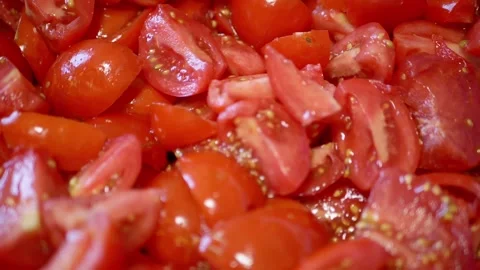 Close up view of chopped red tomato pieces for salad preparation Stock Footage 330118826