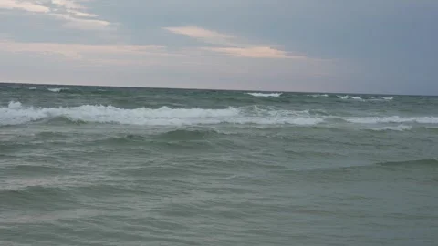 Close-up view of choppy ocean waves and cloudy sky, water surface Stock Footage 345689644