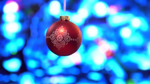 Close up view of Christmas red ball against bokeh background Stock Footage 166385423