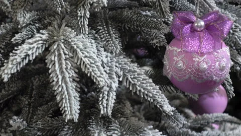Close up view of a Christmas tree with a pink Christmas ball Stock Footage 116340023
