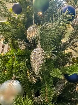Close-up view of a Christmas tree with silver and blue decoration Stock Photos