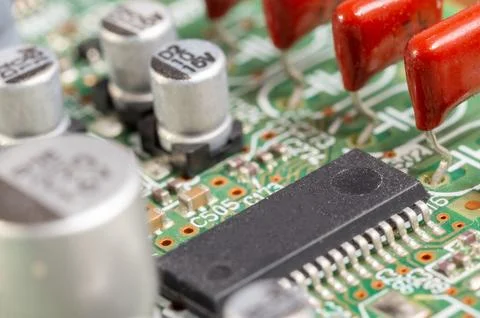 Close-up view of a circuit board with electronic components and connectors. Stock Photos