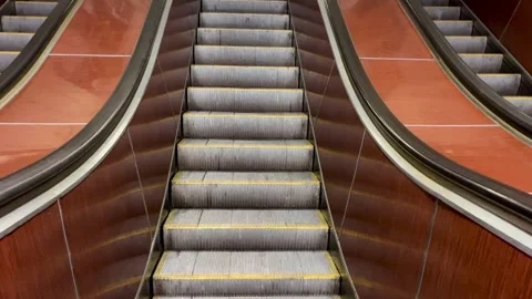 Close-up view of a classic escalator in a retro-style subway or public transport Stock Footage 334342713
