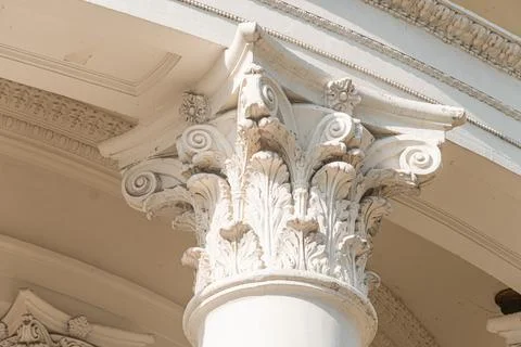Close-up view of a classical column capital, likely from an old European ci.. 写真素材
