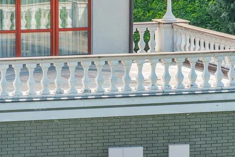 Close-up view of a classical stone bridge in a modern city, under natural sun Stock Photos