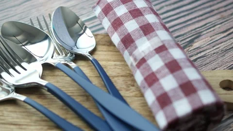 Close up view of clean kitchenware, including forks and spoons, placed on a.. Stock Footage 333033144