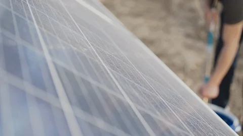 Close up view of cleaning solar baterries with mop Vídeo Stock 104381408