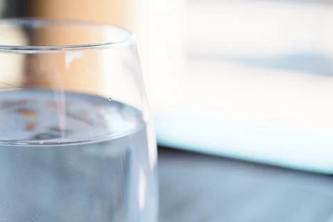 A close-up view of a clear glass filled with pure still water Stock Photos