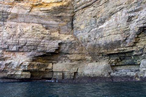 Close-up view on the cliffs at Farol do Cabo de Sao Vicente, Portugal Stock Photos