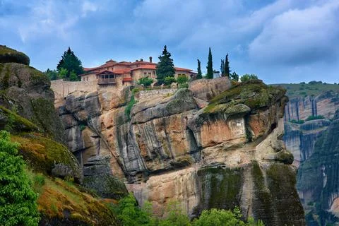 Close view of clifftop Eastern Orthodox monastery of Holy Trinity or Agia Triada Stock Photos