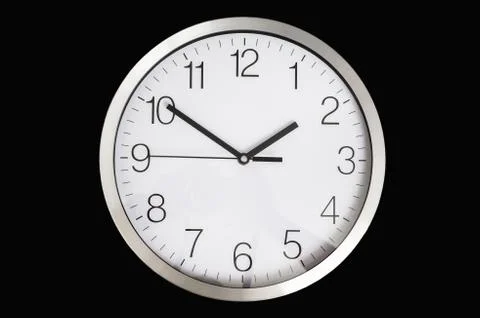 Close-up view of clock isolated on black - deadline and time concept Stock Photos
