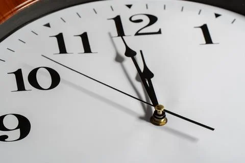 Close-up view on clock. Twelve o'clock. Stock Photos