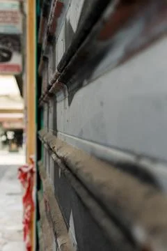 Close up view of closed shop roll with graffiti on it Stock Photos