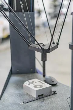 Close-up view of a CNC machine on an industrial floor, featuring metallic sup Stock Photos