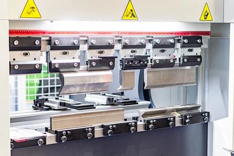 Close-up view of a CNC machine, with metallic components, bolts, levers, and  Stock Photos