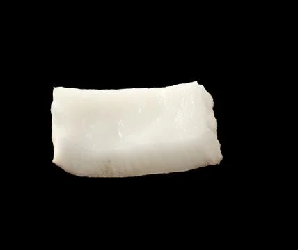 Close up view of coconut piece isolated on black background Stock Photos