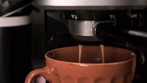 Close up view of coffee pouring from espresso machine into a cup. Stock Footage 152003904