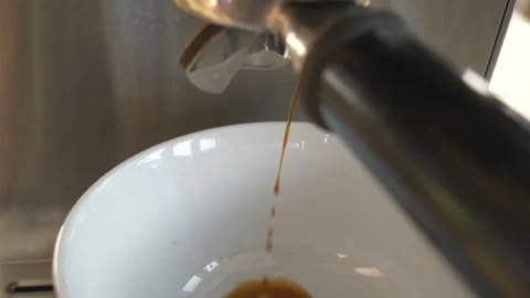 A close up view of coffee pouring out of the coffee machine. Stock Footage 151442593