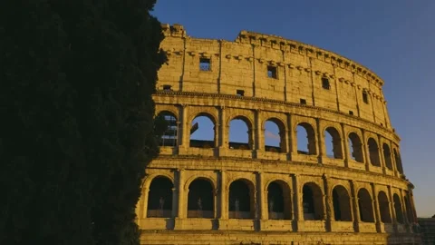 Close-up view of Coliseum at the sunset, behind the tree, 4K Footage Stock Footage 153955875