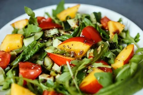 Close up view of colorful delicious vegetarian salad. Stock Photos