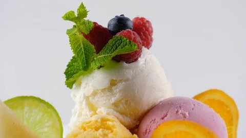 Close up view of colorful Ice Cream balls decorated with berries Stock Footage 77828709