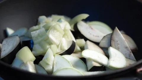 Close up view of colorful steaming vegetables frying on a pan being mixed and Video stock 114059146