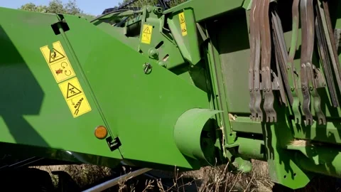 Close view of a combine harvester header being connected to the machine Stock Footage 345522800