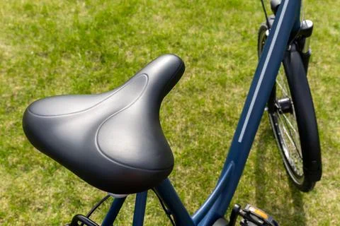 Close-up view of a comfortable, ergonomic black bicycle seat mounted on a s.. 写真素材
