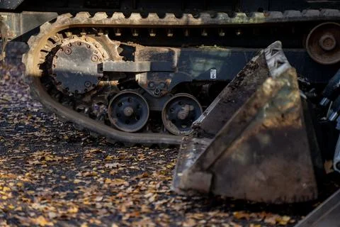 Close view of compact tracked loader undercarriage Stock Photos