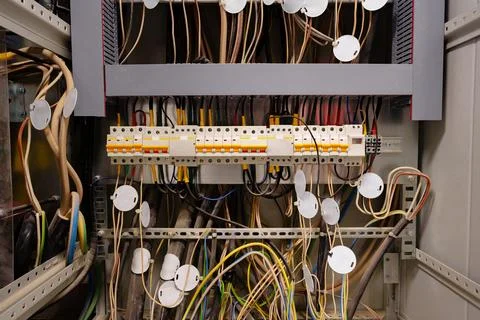 Close view of complex electrical wiring in a control panel at a technology Stock Photos