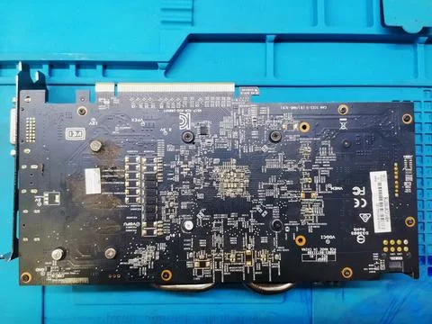 A close-up view of the complex printed circuit board on the back of a computer 스톡 사진