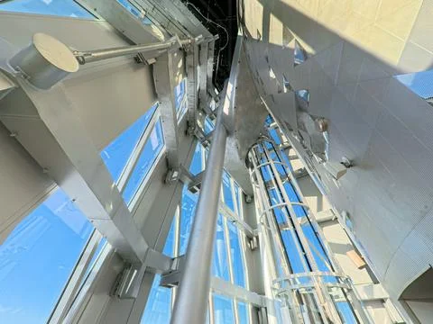 Close up view of the complex steel and glass framework inside a modern high Stock Photos