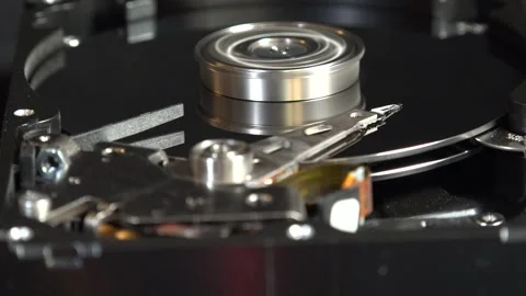 Close-up view of the components of the open hard drive in rotation, in detai Stock Footage 293905567