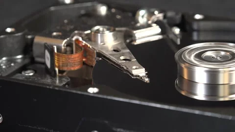 Close-up view of the components of the open hard drive in rotation, in detai Stock Footage 293905786