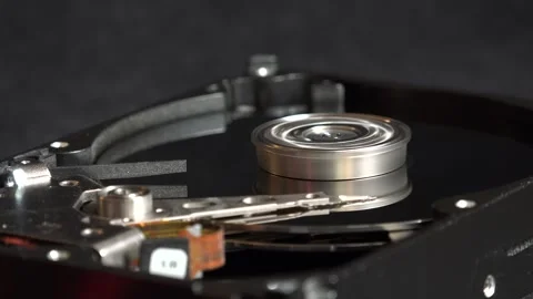 Close-up view of the components of the open hard drive in rotation, in detai Stock Footage 293905810