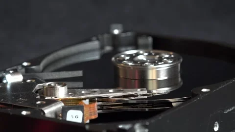 Close-up view of the components of the open hard drive in rotation, in detai Stock Footage 293905827