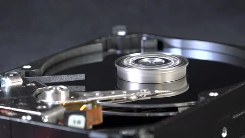 Close-up view of the components of the open hard drive in rotation, in detai Stock Footage 293906009