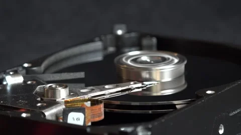Close-up view of the components of the open hard drive in rotation, in detai Stock Footage 293906877